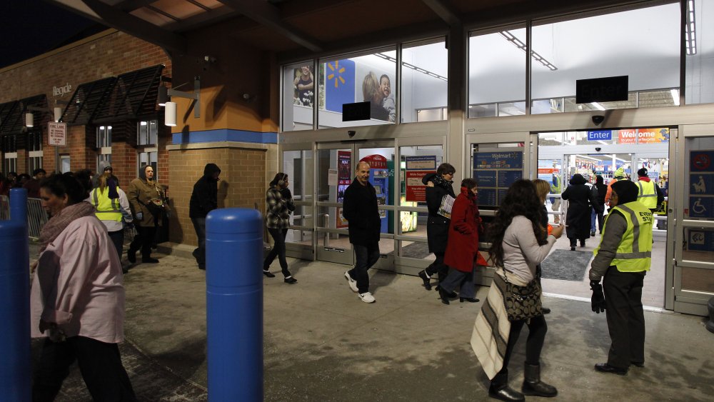 Walmart customers waiting in line Thanksgiving Day for Black Friday sales to begin