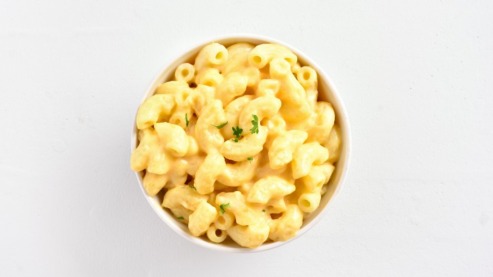 mac and cheese against a white stone background