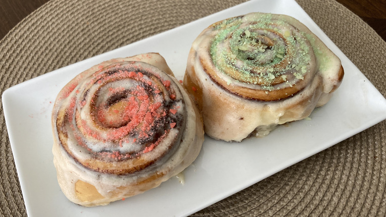 two Cinnabons topped with Warheads candy