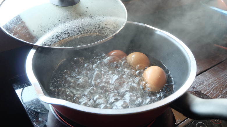 Eggs boiling in water