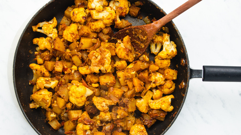 potatoes and cauliflower in pan