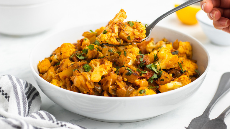 aloo gobi in bowl/spoon