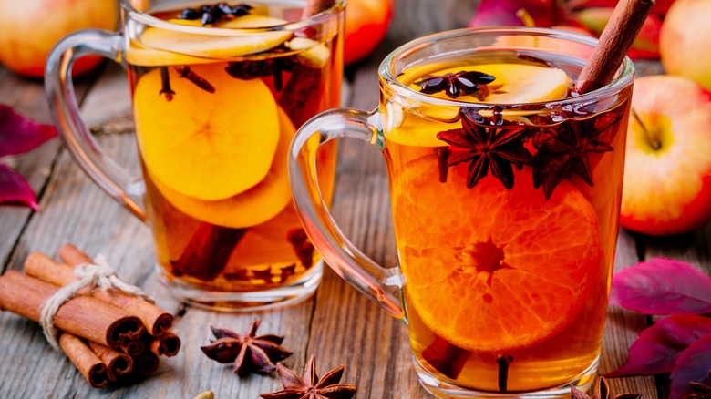 mulled cider in glasses with oranges