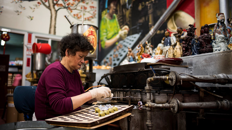 worker at Golden Gate Fortune Cookie Factory