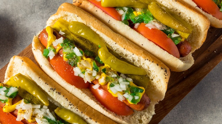 Chicago hot dogs on a wooden board