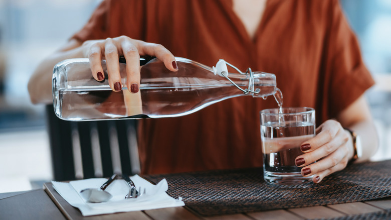 Pouring water into glass