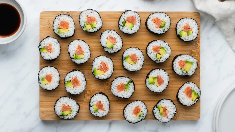 smoked salmon sushi on board