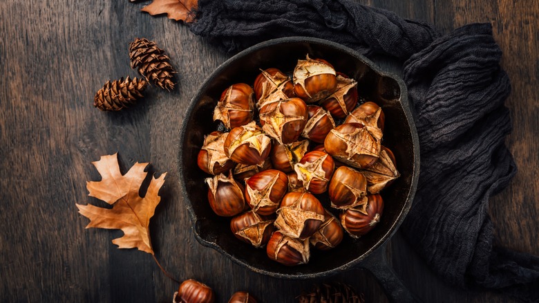 Roasted chestnuts in a dish on a table