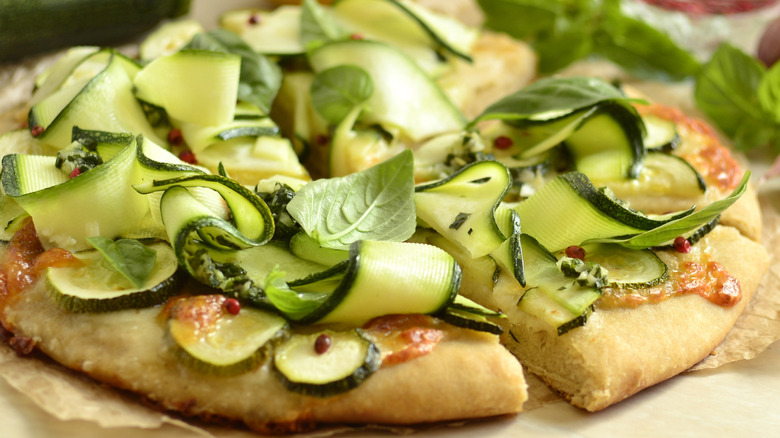 Shaved zucchini ribbons on pizza