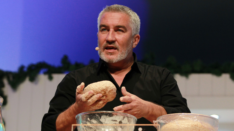 Paul Hollywood holding dough