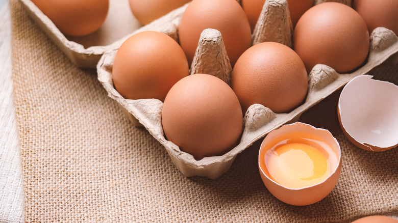 egg carton with an open egg