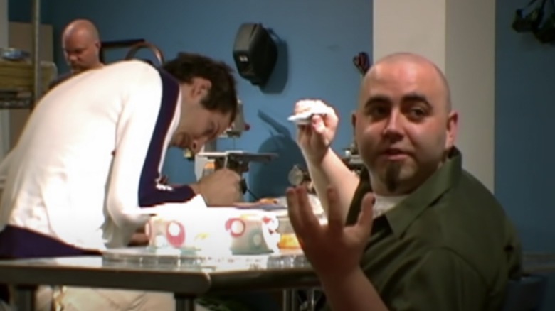 Duff Goldman working on cake on "Ace of Cakes"