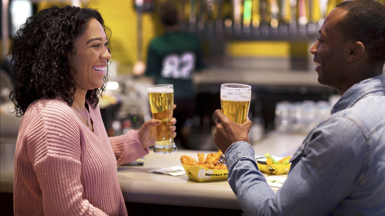 Couple enjoying beer at Buffalo Wild Wings