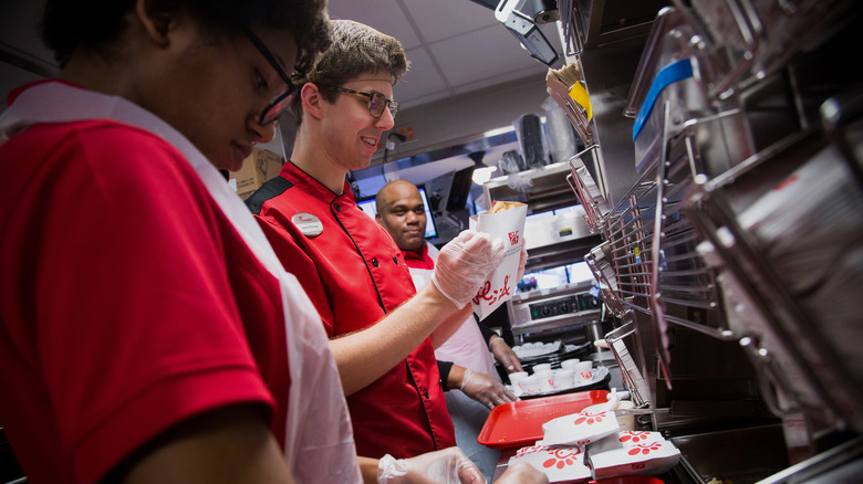 Chick-fil-A workers preparing food