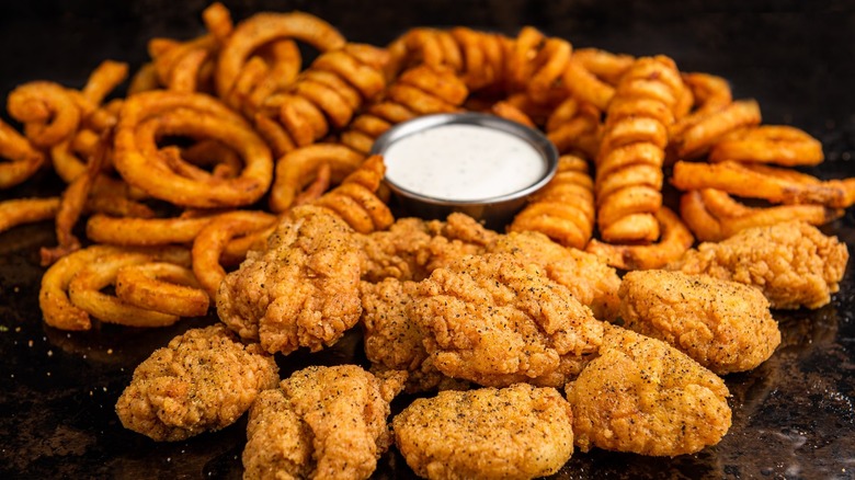 curly fries and boneless wings with dipping sauce