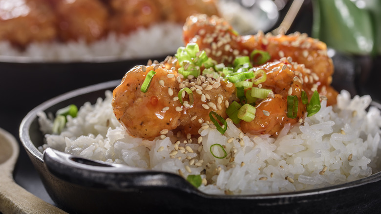 Orange chicken served over rice