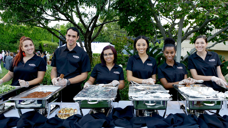 Outback steakhouse employees catering outside