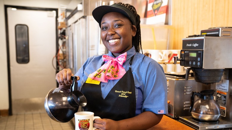 Waffle House employee serving coffee