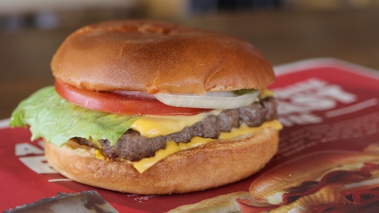 Wendy's burger with lettuce onion tomato