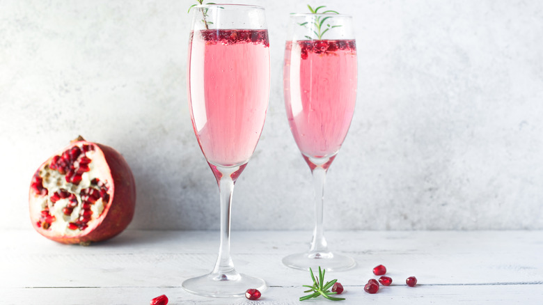 Pomegranate mimosas on white background