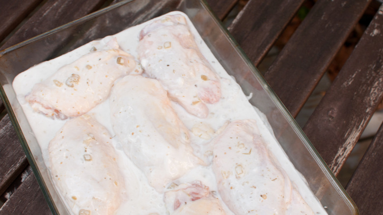 Raw chicken in buttermilk marinade