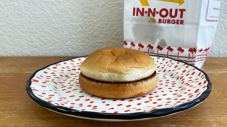 Hamburger bun on polka-dotted plate