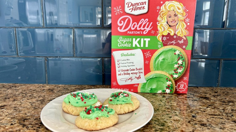 three sugar cookies with green frosting