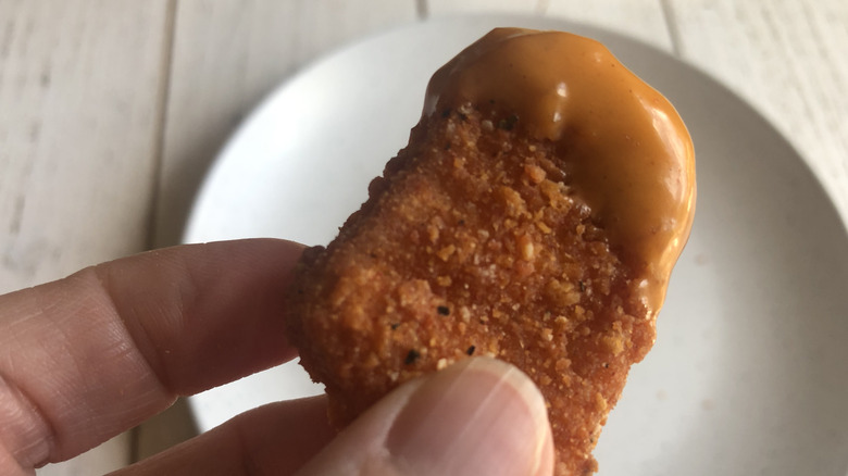 A Burger King Ghost Pepper Chicken Nugget with sauce