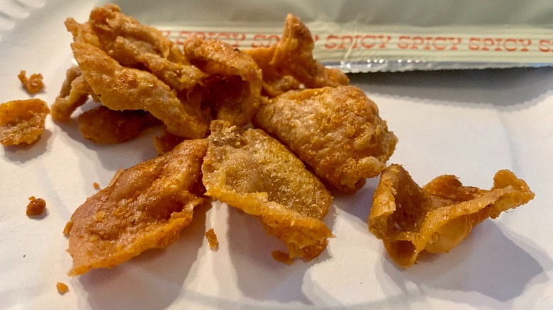 A pile of fried chicken skin chips