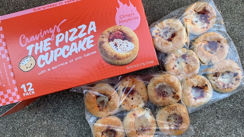 Two bags of pizza cupcakes next to the box