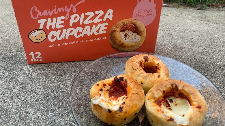 A plate of Pizza Cupcakes next to the box