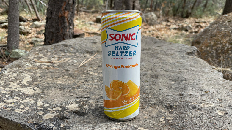 orange pineapple can in forest