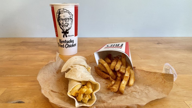 Mac and cheese wrap with fries and a drink