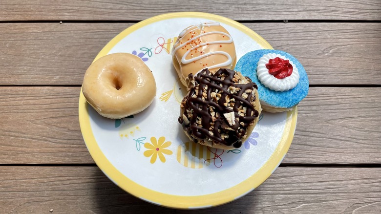 four doughnuts on a plate