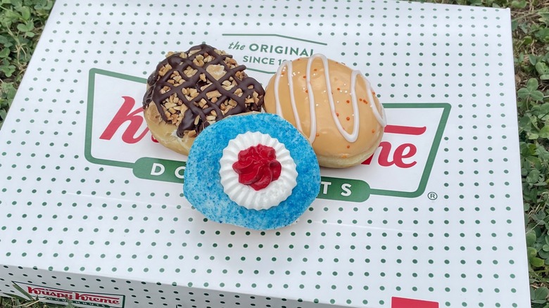 three doughnuts on krispy kreme box