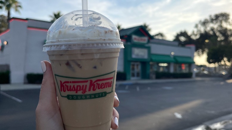 hand holding iced latte