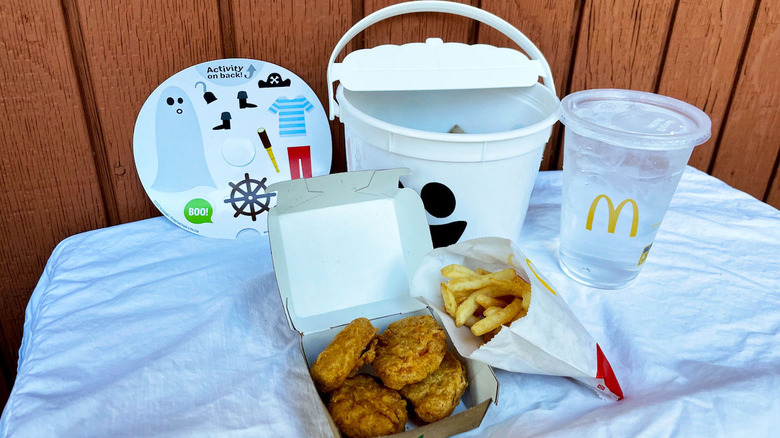 McDonald's bucket with food, drink, and activity