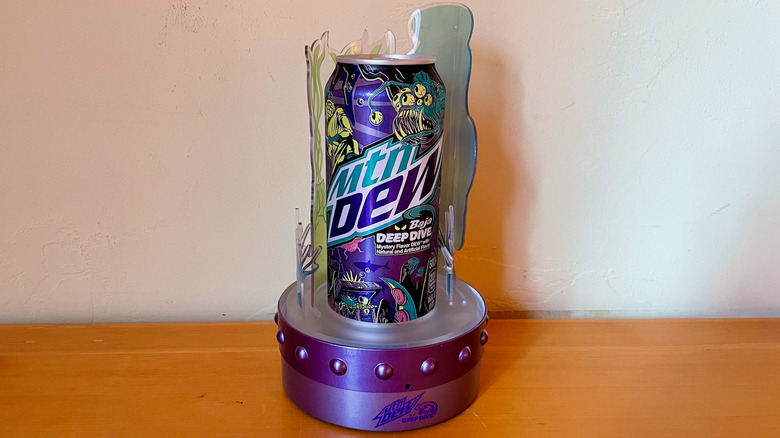 Hand holding Mountain Dew Deep Dive