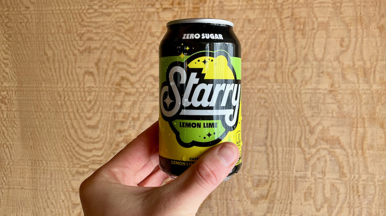 Hand holding Starry can