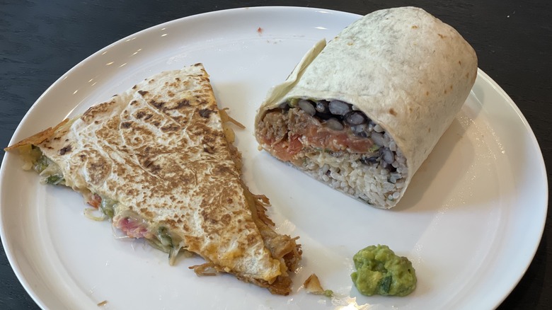 a burrito and quesadilla on a plate