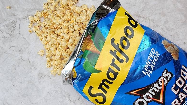 Smartfood popcorn spilling from bag