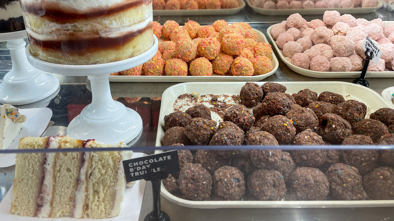 The dessert case at the Flagship Milk Bar store in NYC showcasing cake truffles