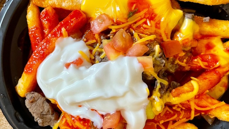 Taco Bell's New Loaded TRUFF Nacho Fries with sour cream