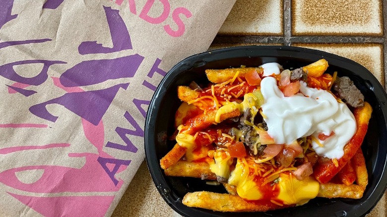 Taco Bell's New Loaded TRUFF Nacho Fries with bag