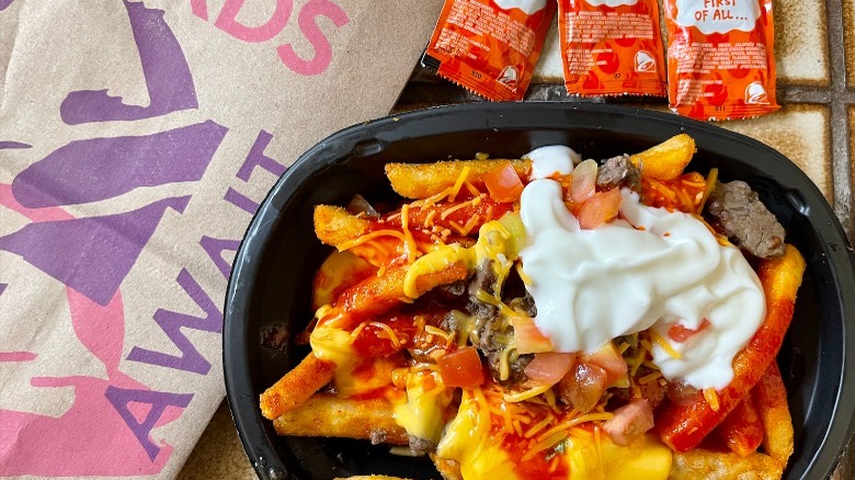 Taco Bell's New Loaded TRUFF Nacho Fries with sauce