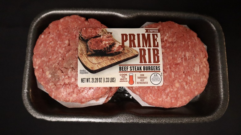 package of four uncooked prime rib burgers