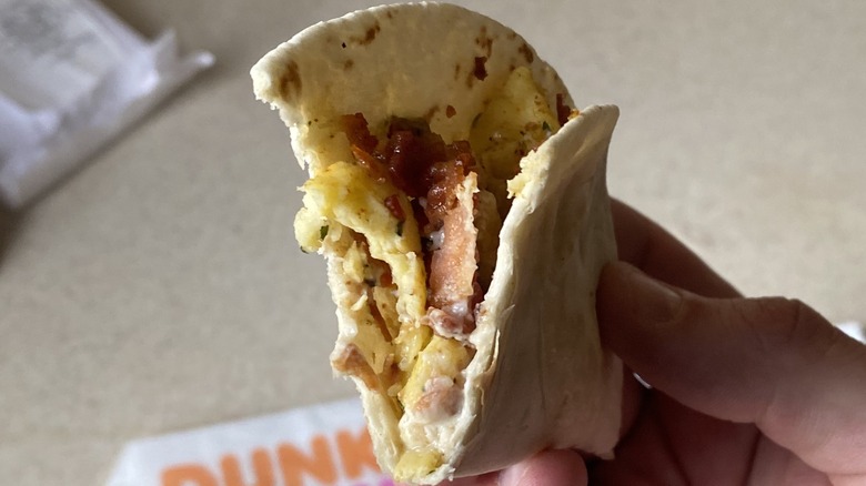 Dunkin' Breakfast Taco with bite taken