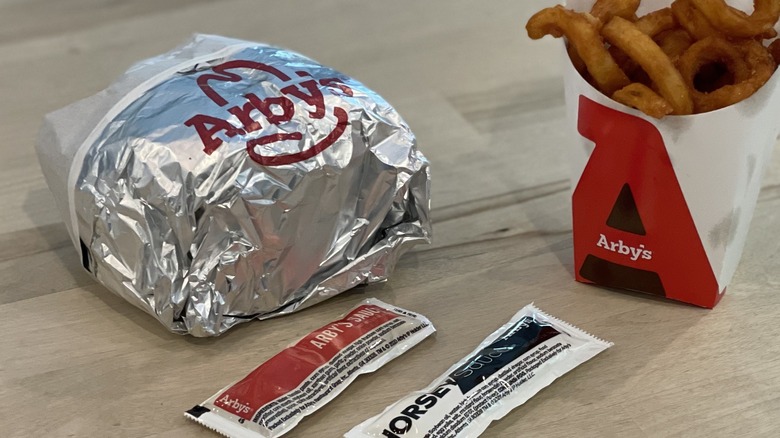 wrapped arby's burger and sauce 