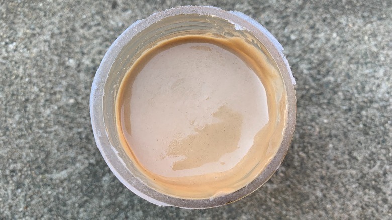 An open jar of a cinnamon spread