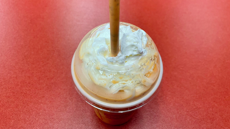 Milkshake with straw top view